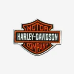 Harley-Davidson logo embroidered iron-on patch with detailed stitching and bold colors.