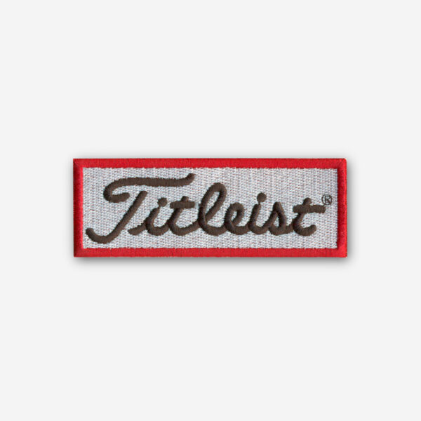 Titleist logo embroidered iron-on patch with premium stitching and clean design.
