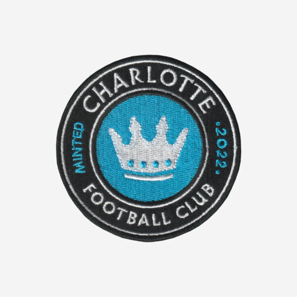 Charlotte Cootball Club Logo Embroidered Iron On Patch Charlotte Football Club embroidered logo patch with crown in blue, black, and white.