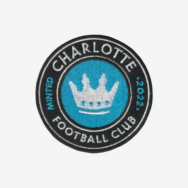 Charlotte Cootball Club Logo Embroidered Iron On Patch Charlotte Football Club embroidered logo patch with crown in blue, black, and white.