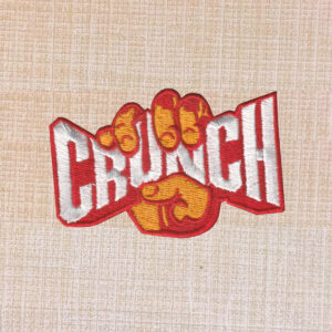 Crunch Fitness logo embroidered iron-on patch for gym wear and accessories.