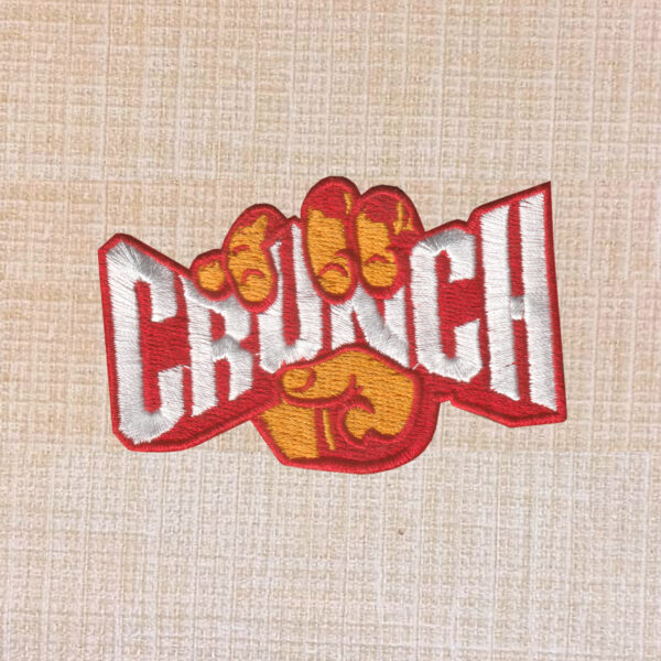 Crunch Fitness logo embroidered iron-on patch for gym wear and accessories.