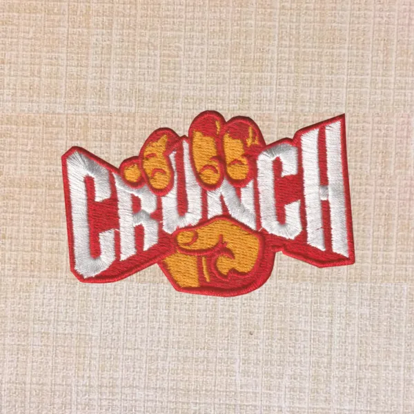 Crunch Fitness logo embroidered iron-on patch for gym wear and accessories.