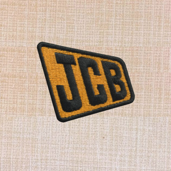 JCB logo embroidered iron-on patch in yellow and black for workwear or accessories.