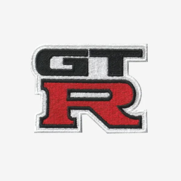 Nissan GT-R Logo Embroidered Iron On Patch Nissan GT-R logo embroidered iron-on patch in red, black, and silver for motorsport apparel.