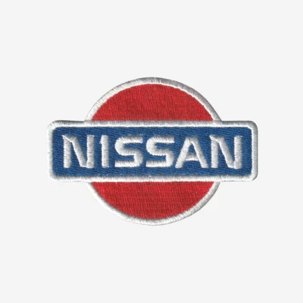Nissan Logo Embroidered Iron On Patch Nissan logo embroidered iron-on patch in silver, black, and red for automotive apparel.