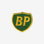 BP logo embroidered iron-on patch in green and yellow on denim surface with merrowed edge